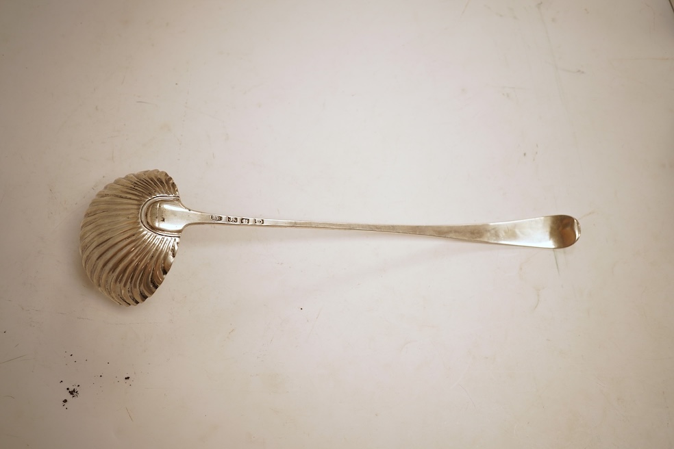 A late George II silver feather edge Old English pattern soup ladle, with fluted bowl, by Richard Rugg, London, 1759, 34cm, 5oz.